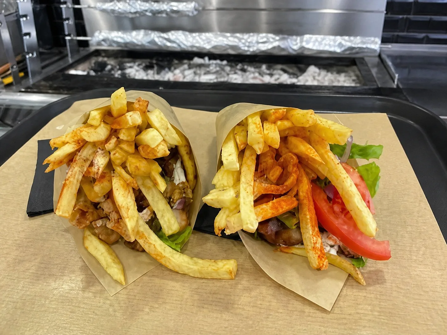 Two filled gyro pitas with fries at Golden Grill House